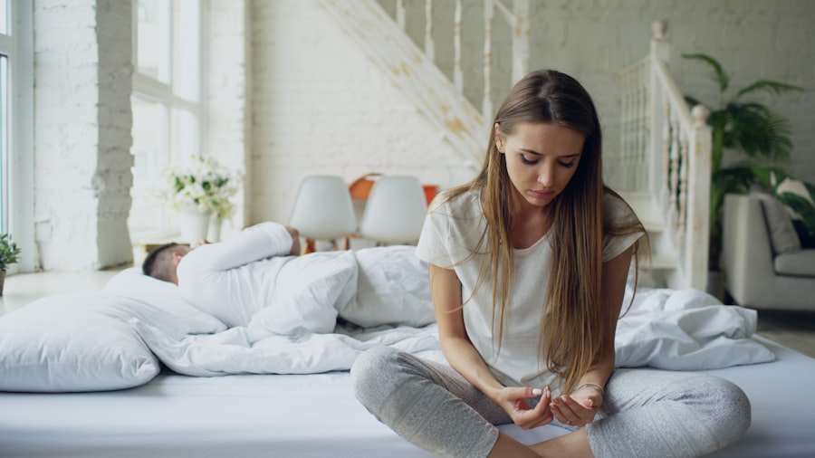 A couple in a quiet bedroom, sitting in distance from each other